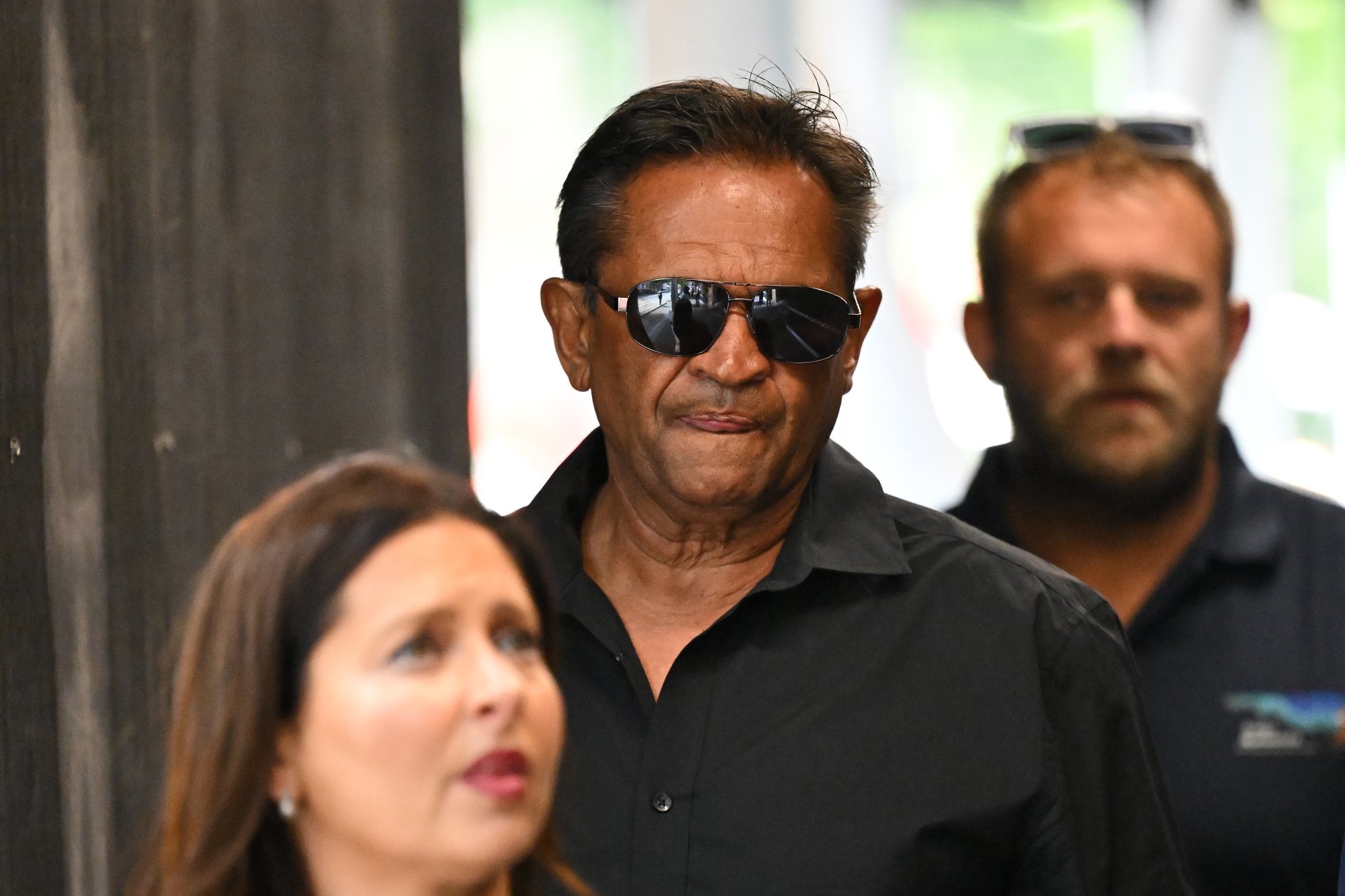 Former AFL player Nicky Winmar found guilty of assaulting woman