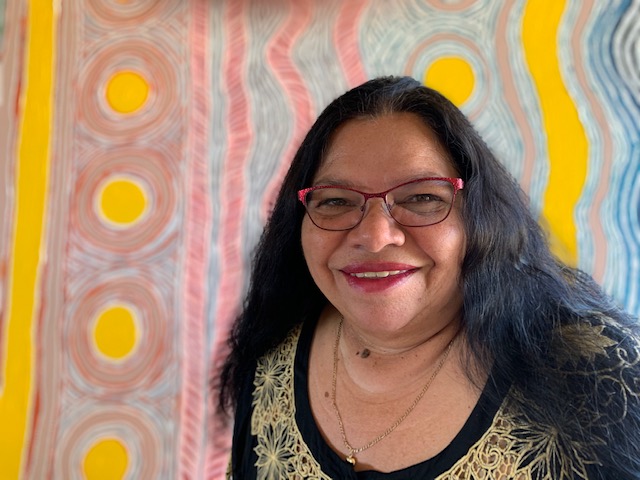 Carol Martin in front of one of her unfinished paintings. (Image: State Library of Western Australia)